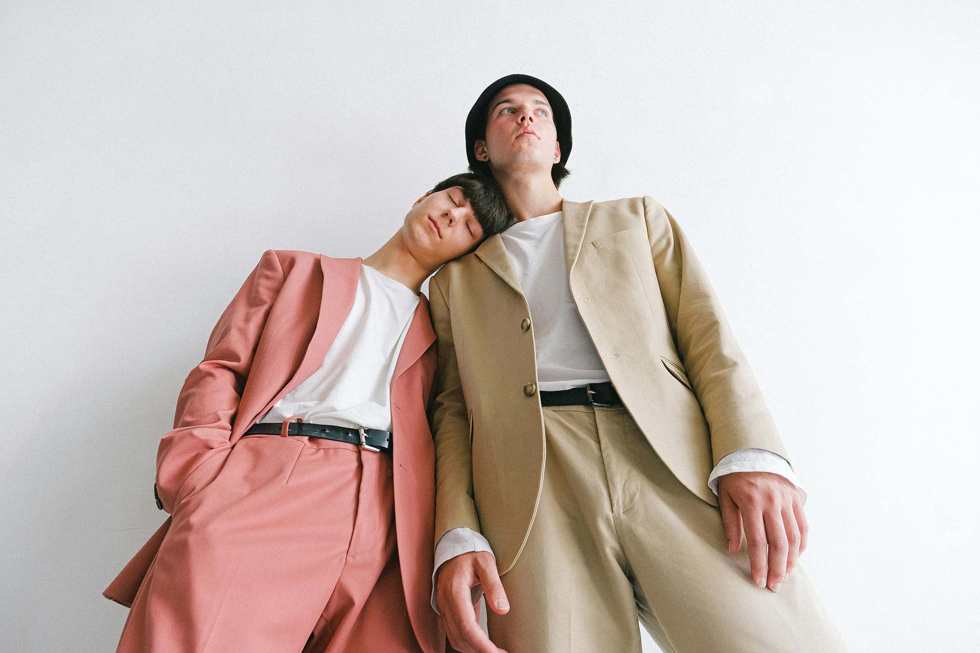 two models in colored suits