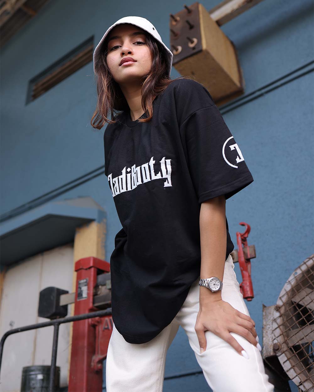 girl in black shirt and white bucket hat