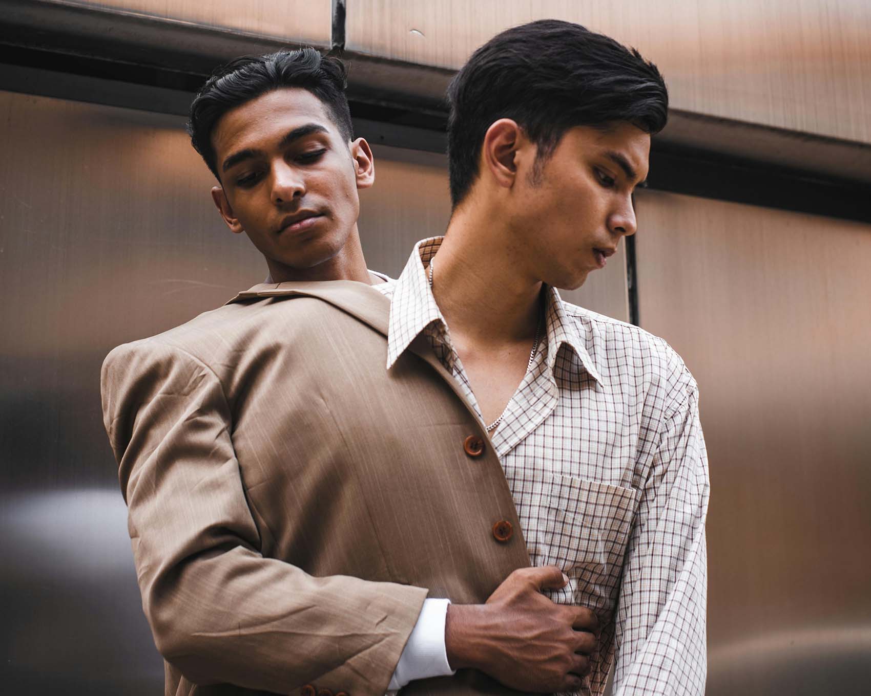 two men with blazers
