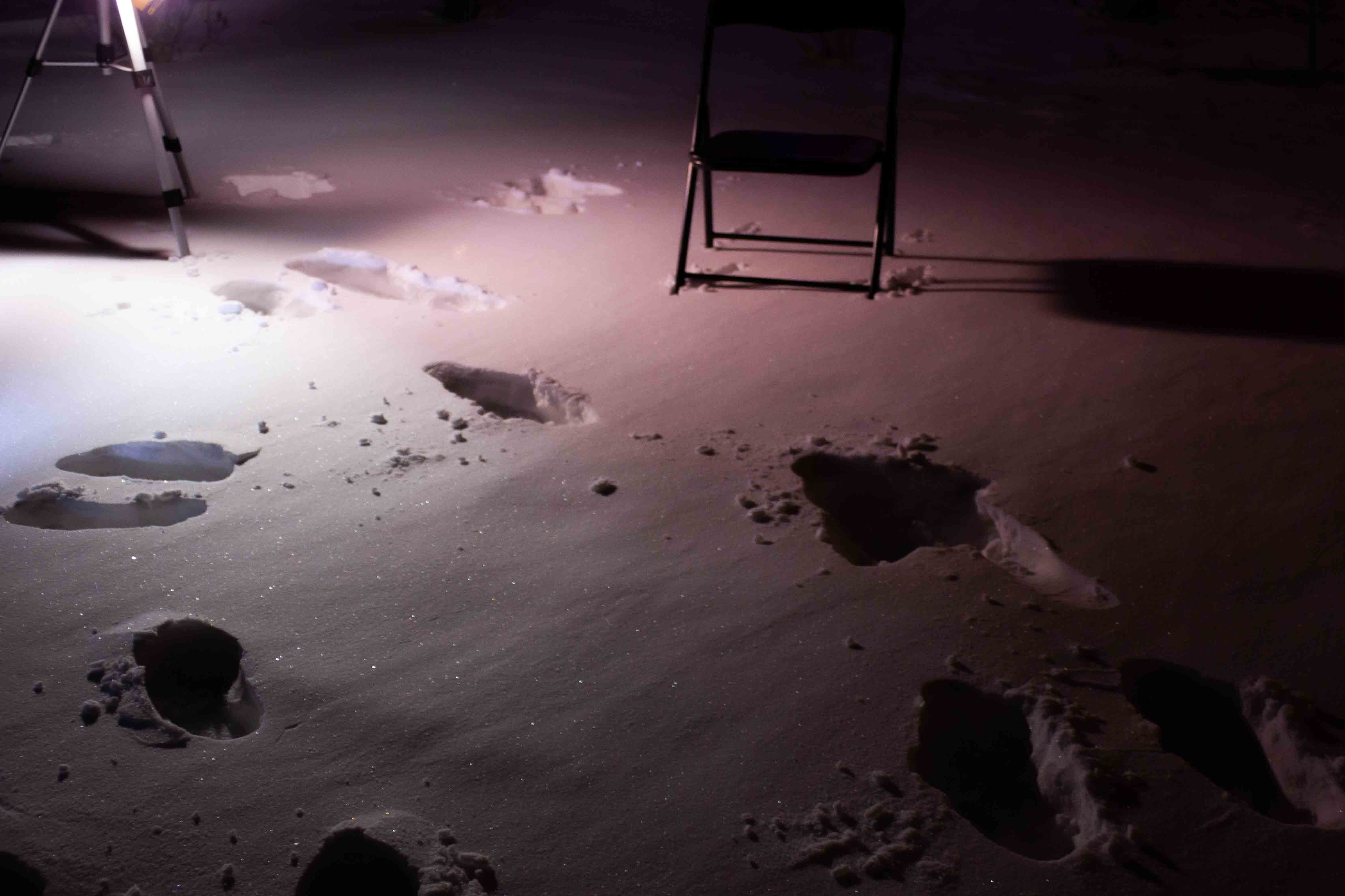 brighter scene, more snowy footsteps with tripod and chair