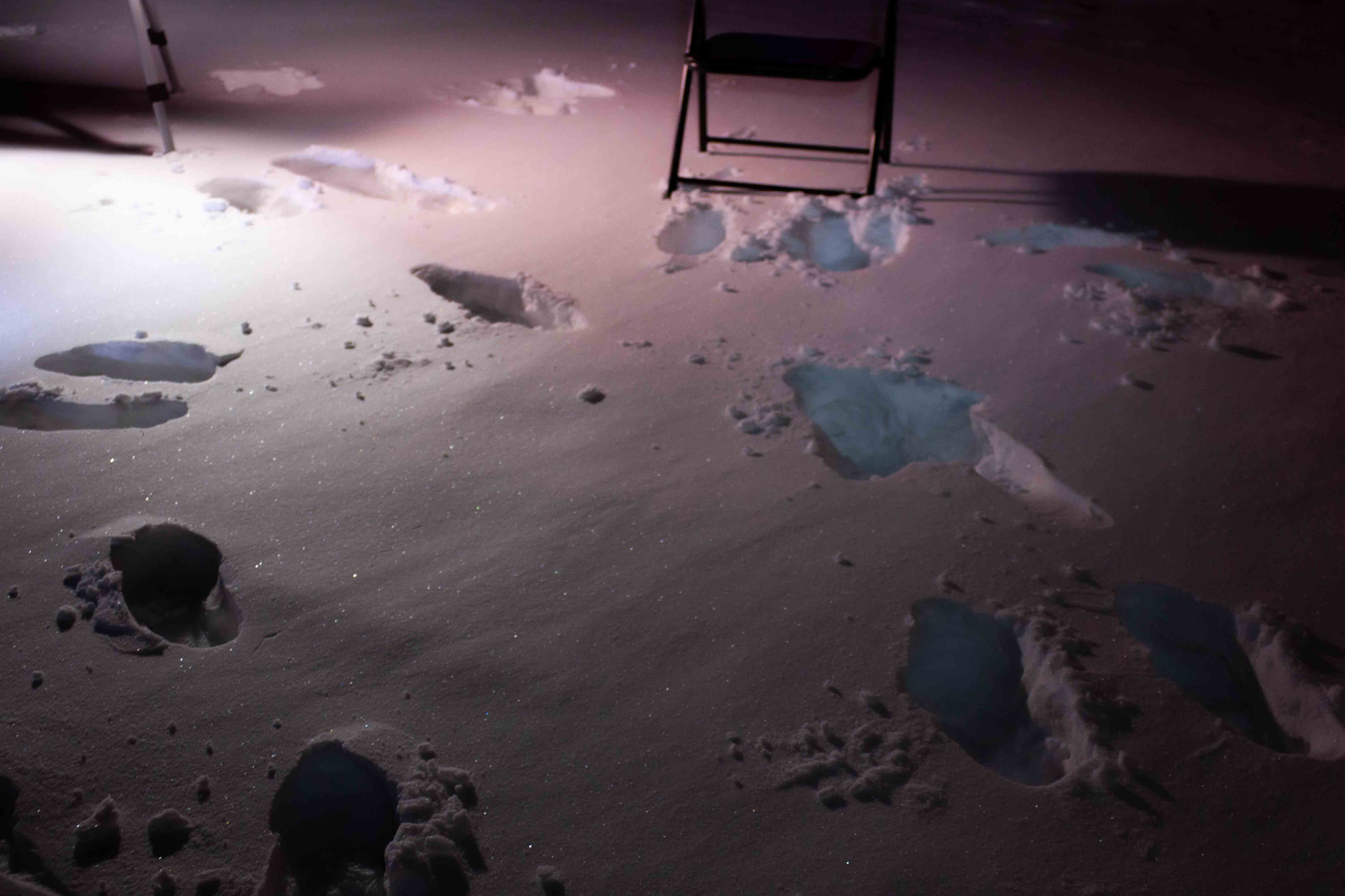 brighter scene, more snowy footsteps with tripod and chair